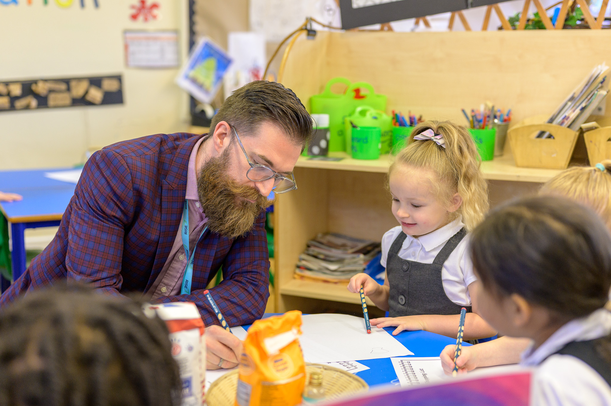 Teacher talking to pupils in the classroom