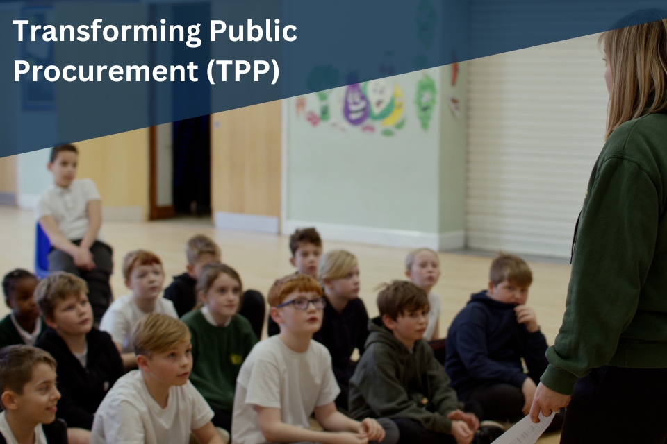 School children sat on floor of a hall in class/assembly with teacher at the front. Text reading 'Transforming public procurement (TPP)' overlapping image